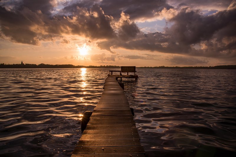 sunset on the lake water mirror sunlight footbridge wood path poland dranikowski sun sky clouds Sunset on the lake фото превью