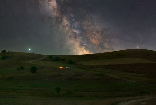 The center of the galaxy hides behind the hills